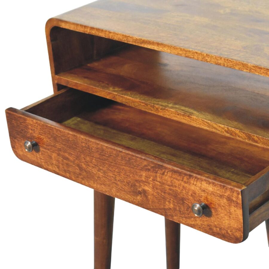 Vintage wooden desk with open drawer.